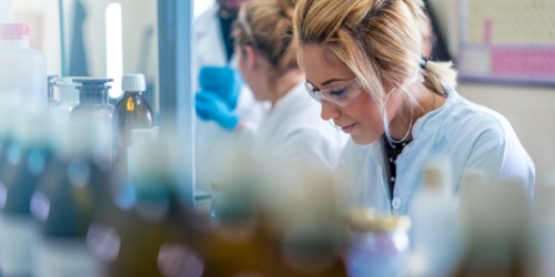 A young woman scientist in a laboratory doing research.